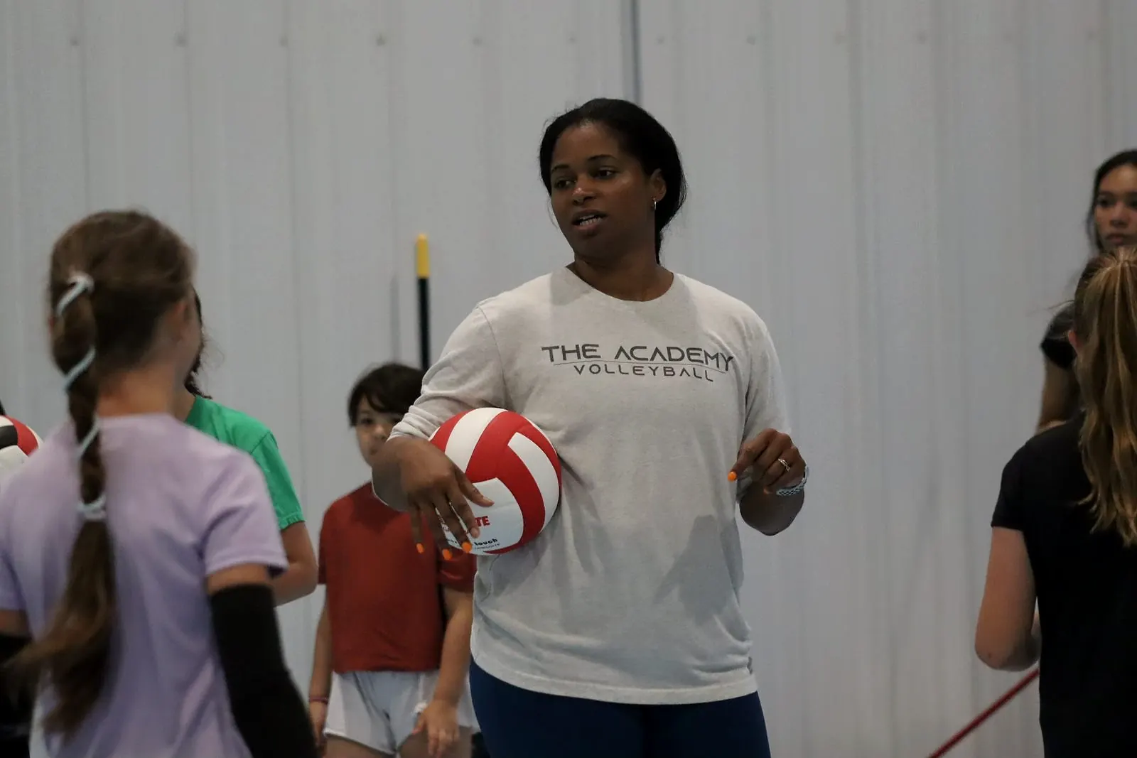 A coach talking an athlete through the next step