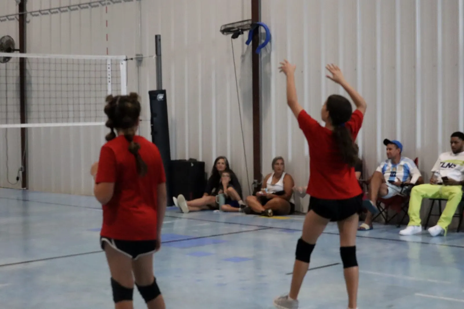 Volleyball athletes at the net